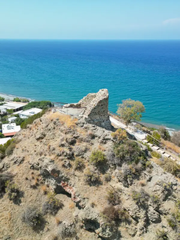 Ruins of the medieval tower on Trulli hill above Kato Pyrgos and the sea