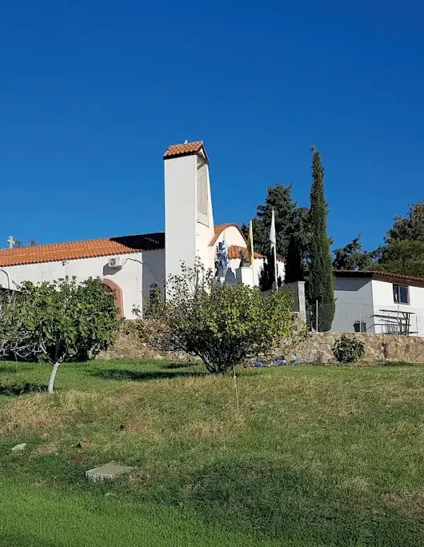Chapel of Saint George on a green slope in Mosfili