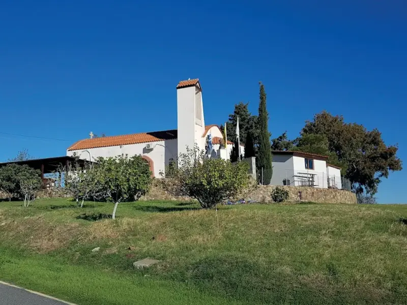 Chapel of Saint George on a green slope in Mosfili